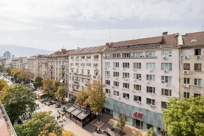 an overhead view of a city street with buildings at The EGO house at Vitoshka Street in Sofia