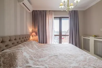 a bedroom with a large bed and a window at The EGO house at Vitoshka Street in Sofia