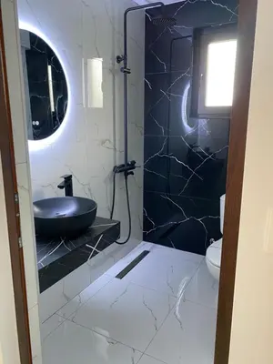 a bathroom with a sink and a toilet at Вила Сънсет 2 in Dospat