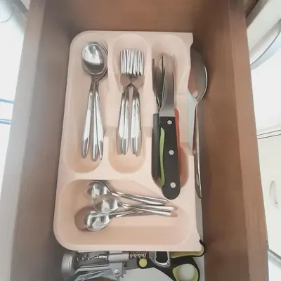 a box with silver utensils in it at lux apartament 88 in Bansko