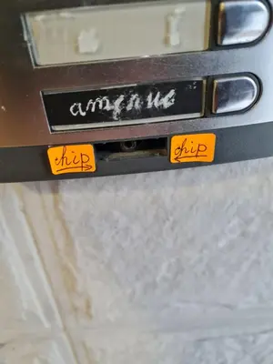a close up of two orange buttons on a machine at South Park apartment free parking near Tokuda in Sofia