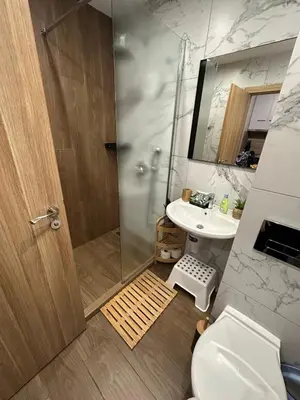 a bathroom with a shower and a toilet and a sink at Mountain studio ASP E63 Borovets Gardens in Borovets