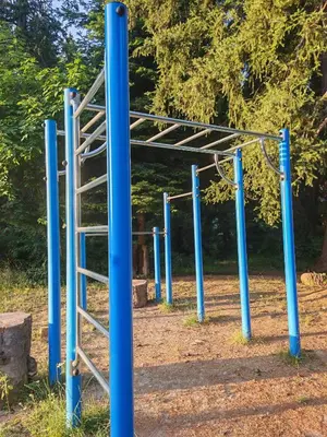 an empty playground with blue poles and a ladder at Mountain studio ASP E63 Borovets Gardens in Borovets