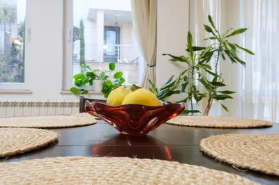 a glass bowl of lemons on a table at The Hill House Free Parking in Plovdiv