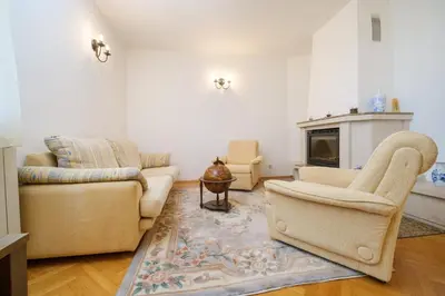 a living room with two couches and a fireplace at The Hill House Free Parking in Plovdiv