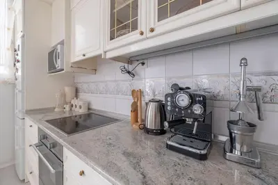 a kitchen with a counter top with a coffee maker at Aristocratic Elegant 2 BDRM spacious home TOP CENTER in Sofia
