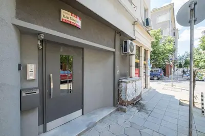 a building with a door on the side of a street at Very Central & Aristocratic 2 Bedroom Apartment with Air conditioning in Sofia