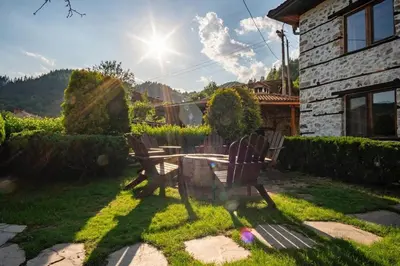 a table and chairs in the yard of a house at Villa Martina in Smilyan
