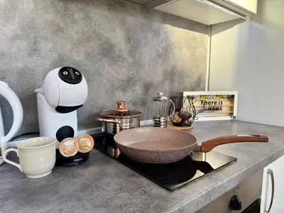 a counter with a mixer and other kitchen items on it at Comfy Studio by Cosher in Sofia