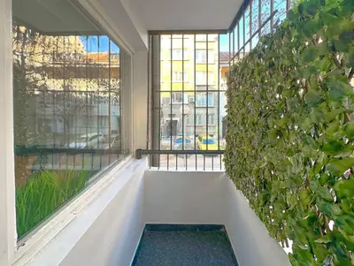 a room with a green wall with a window at Central Duplex Wi-Fi, Kitchen, Netflix, Heating in Sofia