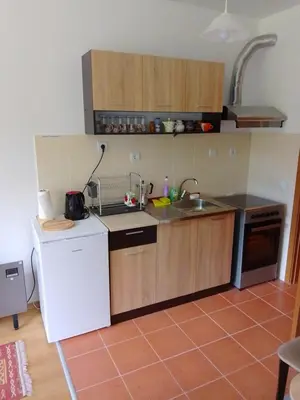 a kitchen with a white refrigerator and a sink at Студио 36 - Семирамида, Боровец in Borovets