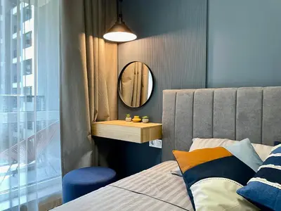 a bedroom with a bed and a mirror at Apartment with Free Underground Parking by COSHER in Sofia