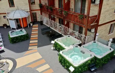 an aerial view of a building with two jacuzzles at Rich House Velingrad in Velingrad