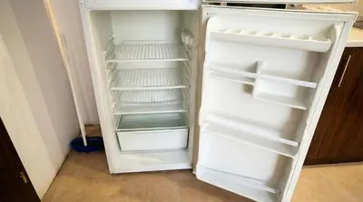 a white refrigerator with its door open in a kitchen at Mountain Paradise 2 - Cosy 2 Bed Mountain View Apartment - Washer in Bansko