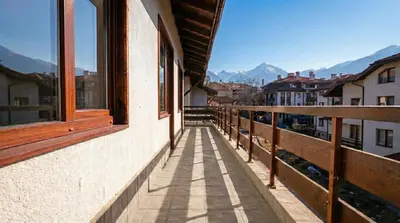 a balcony of a building with a view of the mountains at Mountain Paradise 2 - Cosy 2 Bed Mountain View Apartment - Washer in Bansko