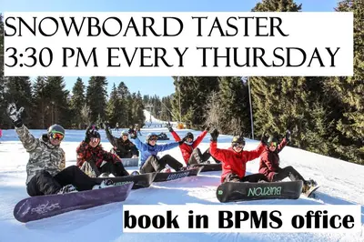 a group of people sitting in the snow on snowboards at Prime location one bed apartment with hydro bath in Royal Plaza in Borovets