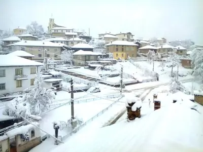 a city covered in snow with buildings in the background at Hotel Hinovi Hvoyna in Hvoyna