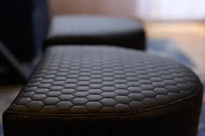 a close up of a black ottoman at Cozy 2BDR & Peaceful Location & Free Street Parking in Blagoevgrad