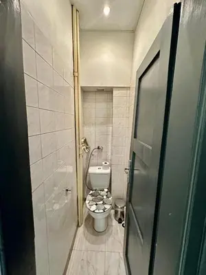 a small bathroom with a toilet in a room at Downtown Serenity Apartment in Sofia