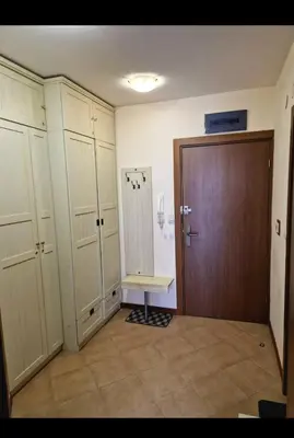 a room with white cabinets and a wooden door at Pirin Golf Hotel & Spa in Razlog