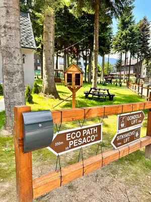 a park with signs on a wooden fence at Stylish Alpine Ski Chalet Tirol in Borovets