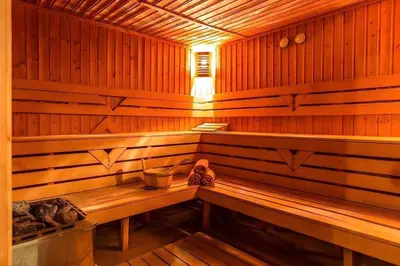 a wooden sauna with a bench in it at Alenik Private Apartment -The Stream Resort Pamporovo in Pamporovo