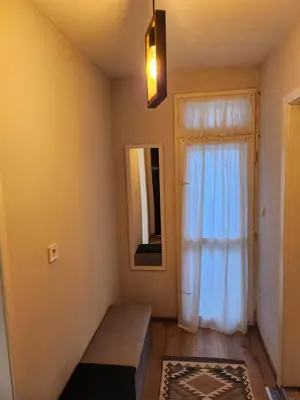 a room with a window and a bench and a mirror at Mini Quiet Central Studio in Pazardzhik