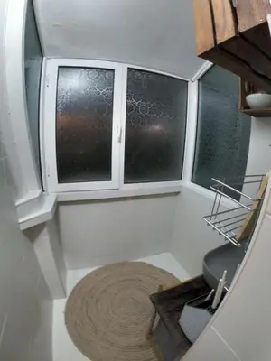 a small room with two windows and a rug at Mini Quiet Central Studio in Pazardzhik