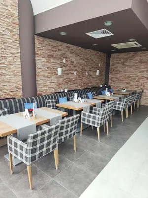 a row of tables and chairs in a restaurant at Aspen Resort Studio I306 in Razlog
