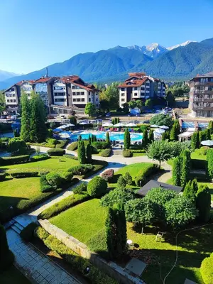 a view of a park with a pool and buildings at Aspen Resort Studio I306 in Razlog