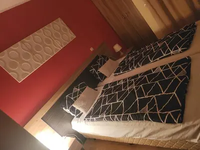 an overhead view of a bed with black and white pillows at Apartment Wintermärchen Bansko in Bansko