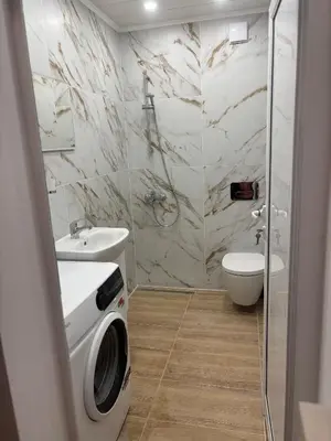 a bathroom with a shower and a sink and a toilet at Inspiration Nook in Sofia