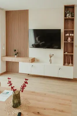 a living room with a large tv on a wall at Apartment Aria 2 in Velingrad