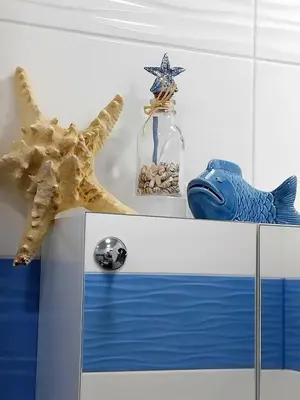a table with a starfish and a glass jar with a star fish at Art Apart - Top Center in Sofia