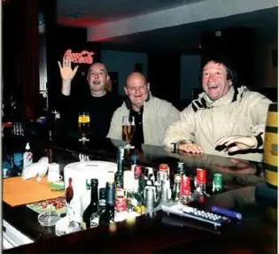 a group of three men standing behind a bar at FLORA Apartment Hotel 412 in Borovets