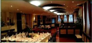 a large dining room with tables with white tablesearcher at FLORA Apartment Hotel 412 in Borovets