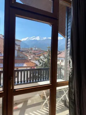 a view from a window of a balcony with mountains at Elegant 3 Alexander Services Apartments luxury four bedroom penthouse in Bansko