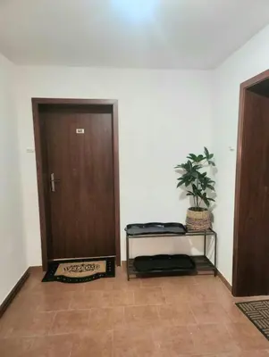 a room with a door and a plant on a table at CrosswayBg Pamporovo in Pamporovo