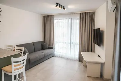 a living room with a couch and a table at Apartment Aria 3 in Velingrad