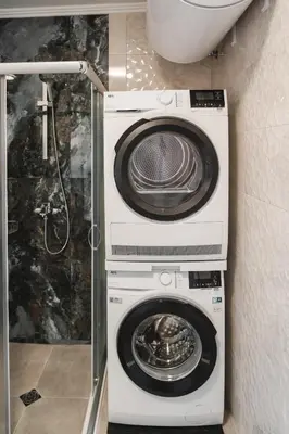 a washing machine and a dryer in a bathroom at Apartment Aria 3 in Velingrad