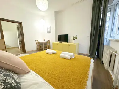 a bedroom with a large bed with towels on it at Aurora Abode - Top Center 1 BDR Fast Wi-fi in Sofia