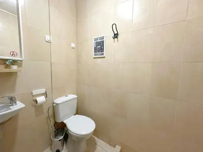 a bathroom with a toilet and a sink at Aurora Abode - Top Center 1 BDR Fast Wi-fi in Sofia