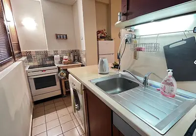 a kitchen with a sink and a counter top at Great location in the Center in Sofia