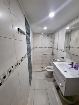 a white bathroom with a sink and a toilet at Fast Wi-Fi, Kitchen, In Sofia in Sofia