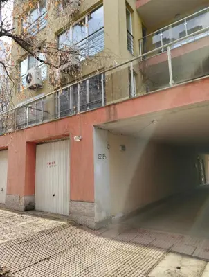 a building with two garage doors and a balcony at Fast Wi-Fi, Kitchen, In Sofia in Sofia