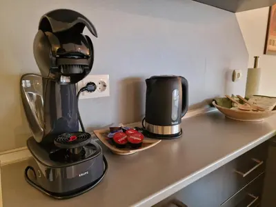 a coffee maker sitting on a counter next to some fruit at Glazne River View - 2BDR & 2BTHR Flat with a View by Flat Mаnager in Bansko