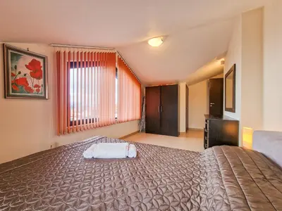 a bedroom with a large bed and a large window at Glazne River View - 2BDR & 2BTHR Flat with a View by Flat Mаnager in Bansko