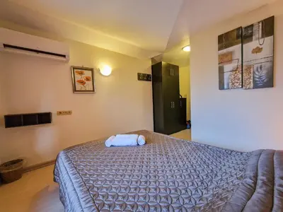 a bedroom with a large bed in a room at Glazne River View - 2BDR & 2BTHR Flat with a View by Flat Mаnager in Bansko