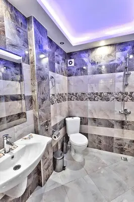 a bathroom with a toilet and a sink at Hotel Elit in Sandanski