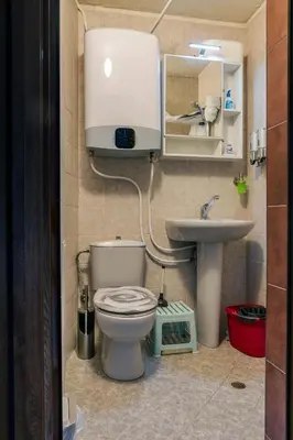 a small bathroom with a toilet and a sink at Best Location in Sofia Center in Sofia